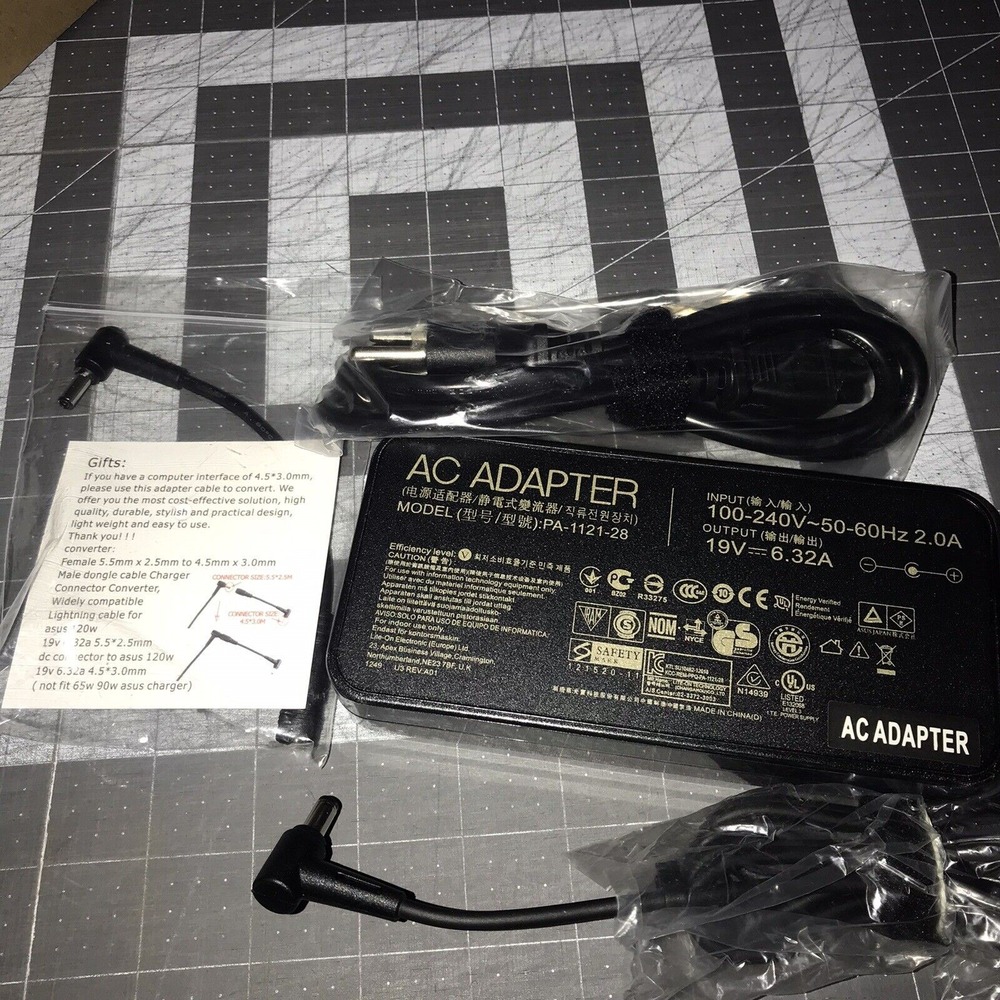 RoHS AC‎ Adapter Model: PA-1121-28 Input 100-240V~50-60Hz Output 19V